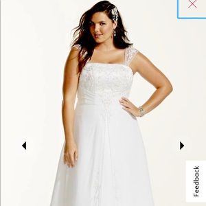 New, in the box and never worn Wedding Dress